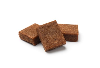 Photo of Three aromatic bouillon cubes isolated on white