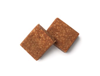 Photo of Two aromatic bouillon cubes isolated on white, top view