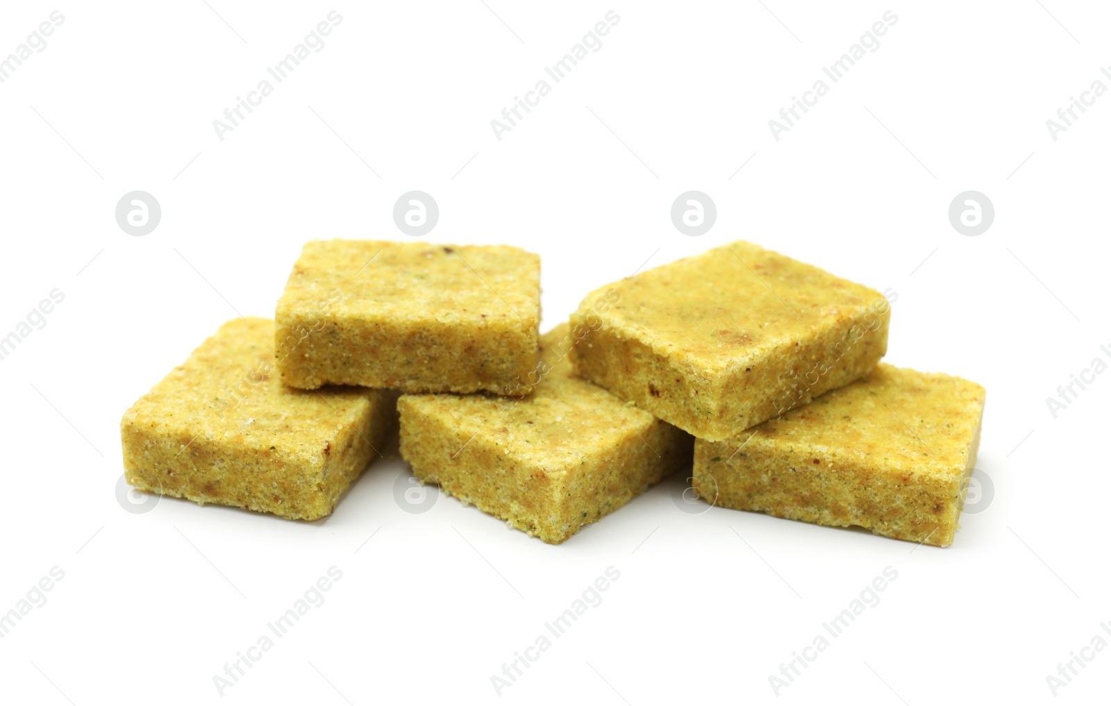 Many aromatic bouillon cubes isolated on white Photo of Many aromatic bouillon cubes isolated on white