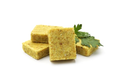 Photo of Aromatic bouillon cubes and parsley isolated on white