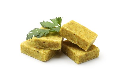 Photo of Aromatic bouillon cubes and parsley isolated on white
