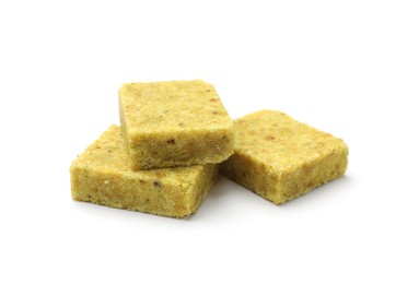 Photo of Three aromatic bouillon cubes isolated on white