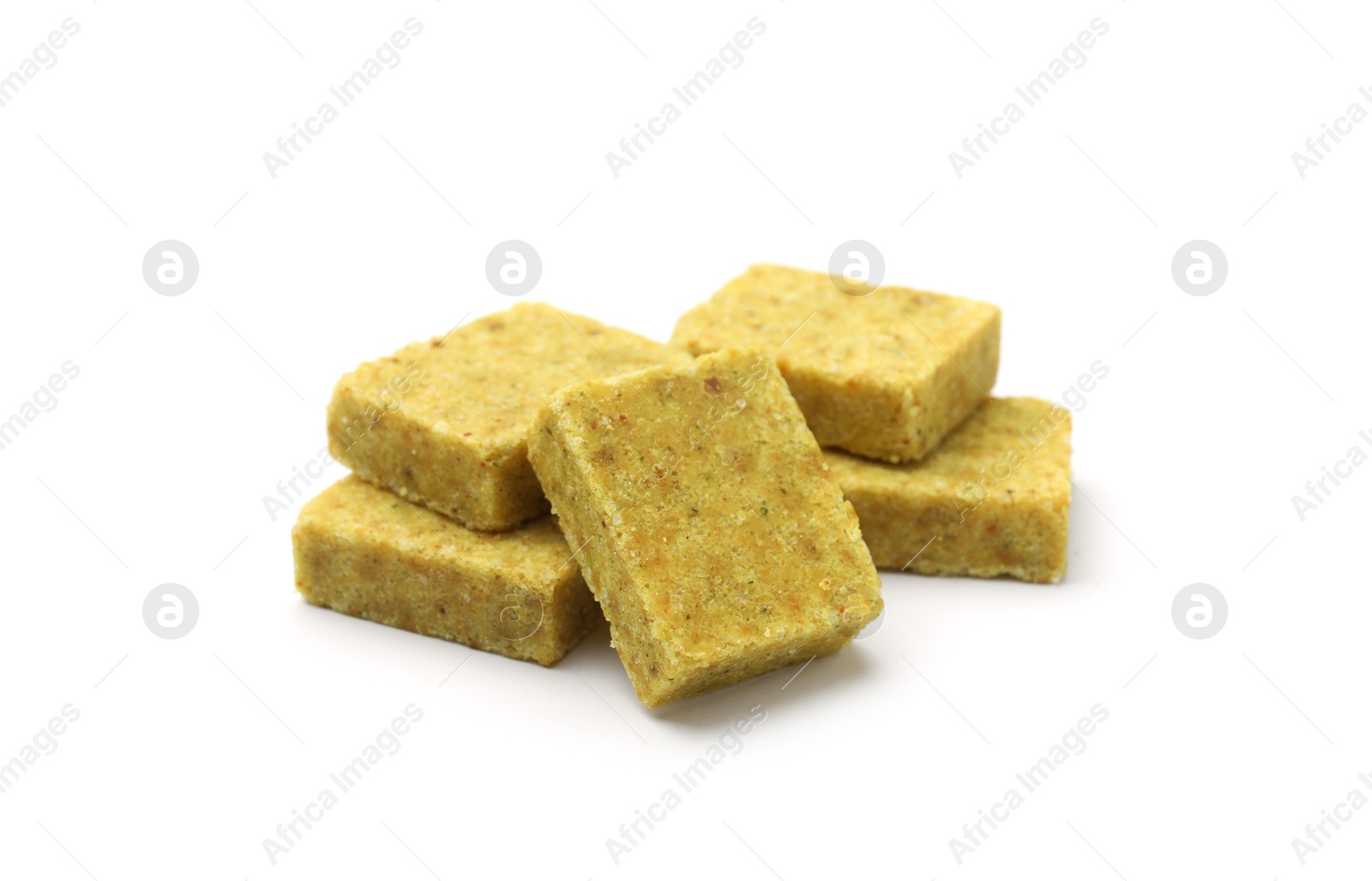 Many aromatic bouillon cubes isolated on white Photo of Many aromatic bouillon cubes isolated on white