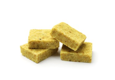 Photo of Many aromatic bouillon cubes isolated on white
