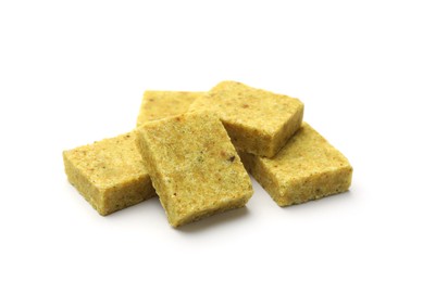 Photo of Many aromatic bouillon cubes isolated on white