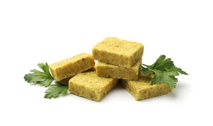 Photo of Aromatic bouillon cubes and parsley isolated on white