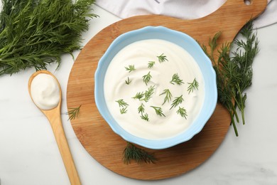 Photo of Tasty sour cream and dill on white table, flat lay