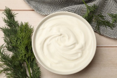 Photo of Tasty sour cream and dill on white wooden table, flat lay