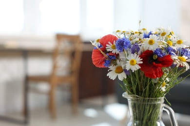 Photo of Beautiful wildflowers in vase at home, closeup. Space for text