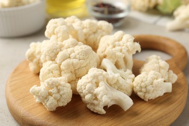 Photo of Fresh raw cauliflower florets on table, closeup