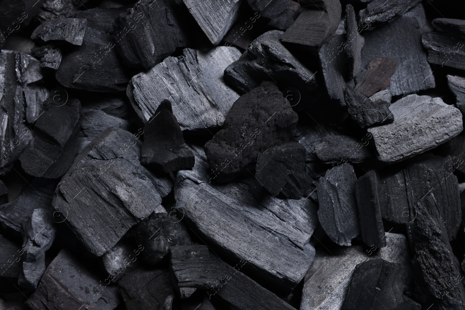 Pieces of black coals as background, top view Photo of Pieces of black coals as background, top view