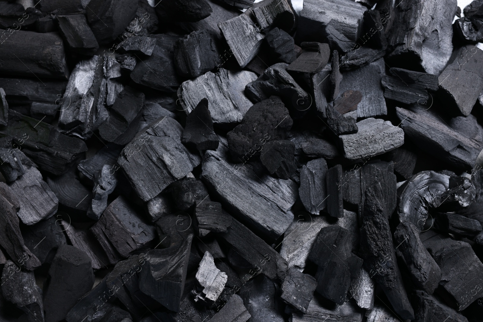 Pieces of black coals as background, top view Photo of Pieces of black coals as background, top view