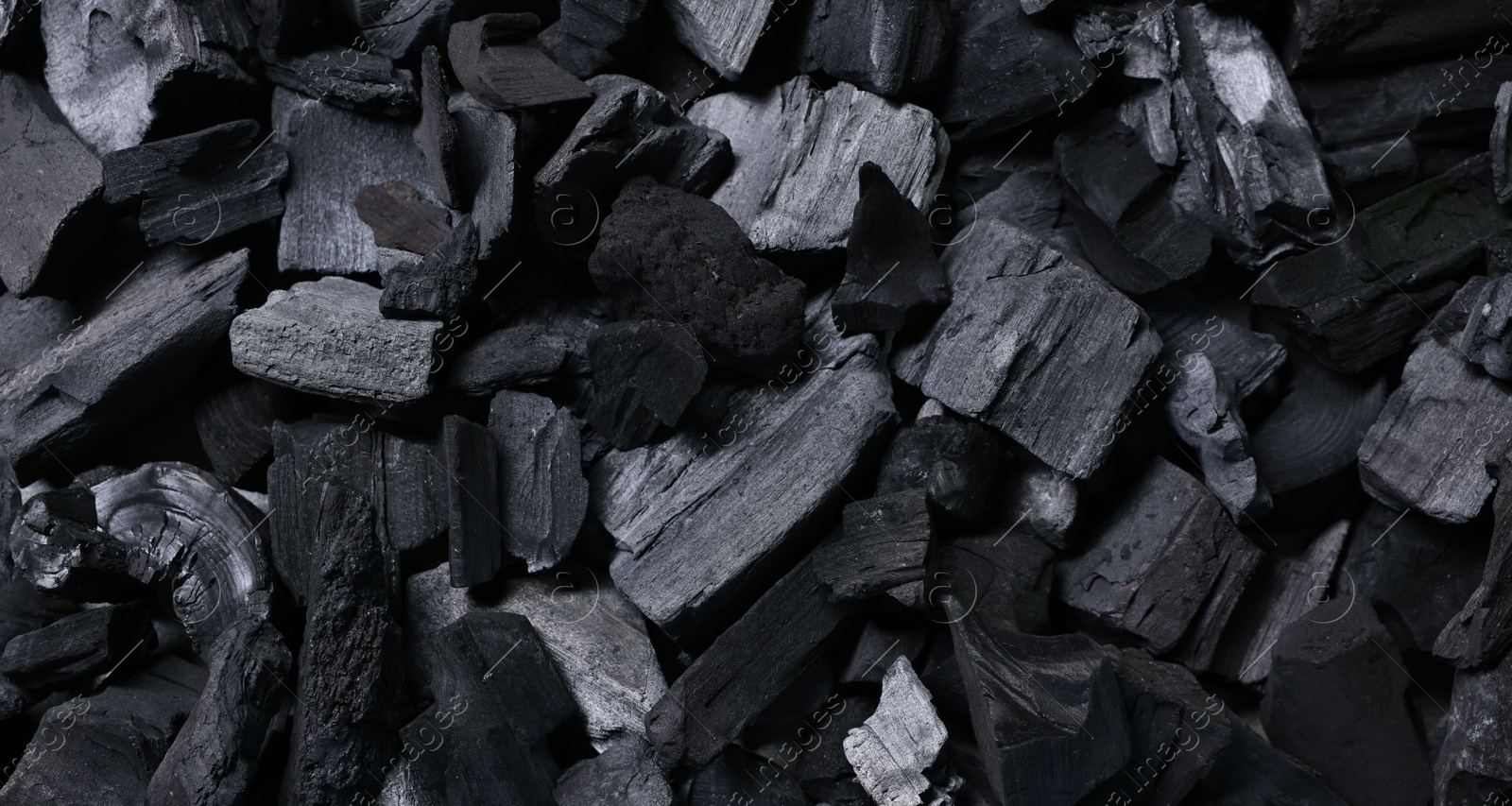 Pieces of black coals as background, top view Photo of Pieces of black coals as background, top view