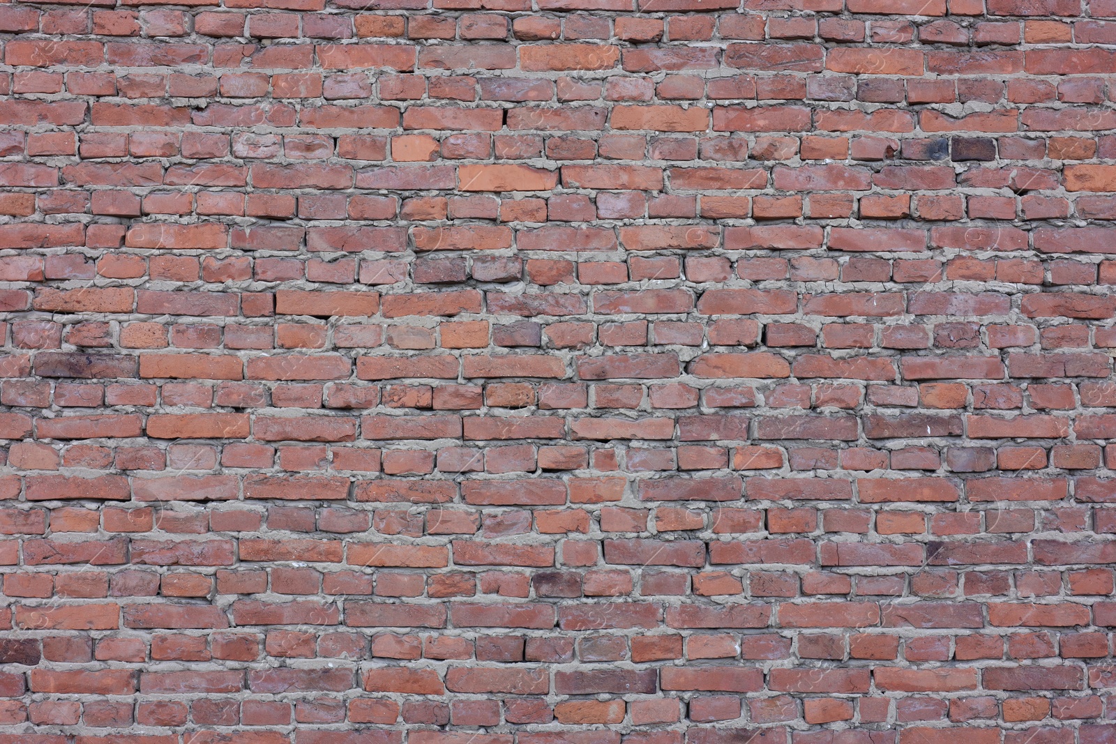 Photo of Texture of red brick wall as background, closeup