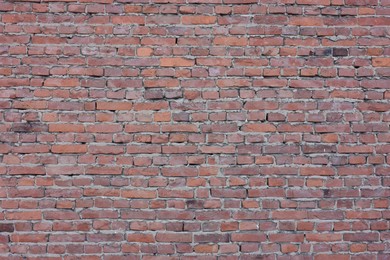 Photo of Texture of red brick wall as background, closeup