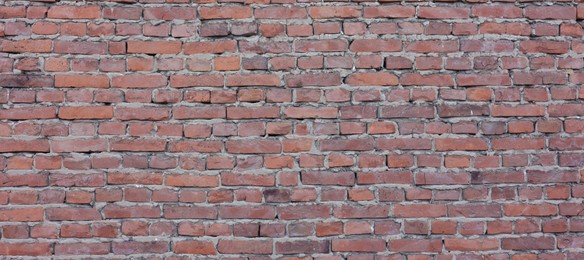 Photo of Texture of red brick wall as background, closeup