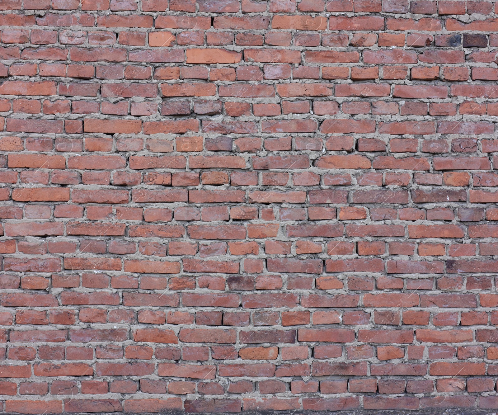 Photo of Texture of red brick wall as background, closeup