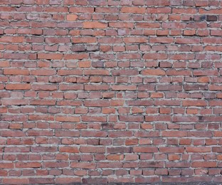 Photo of Texture of red brick wall as background, closeup