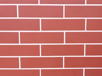 Photo of Texture of red brick wall as background, closeup