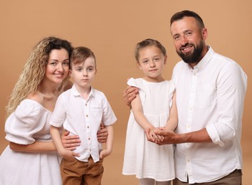 Photo of Portrait of happy family on beige background