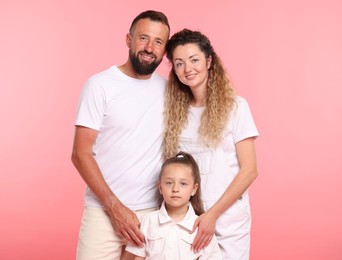 Photo of Portrait of happy family on pink background