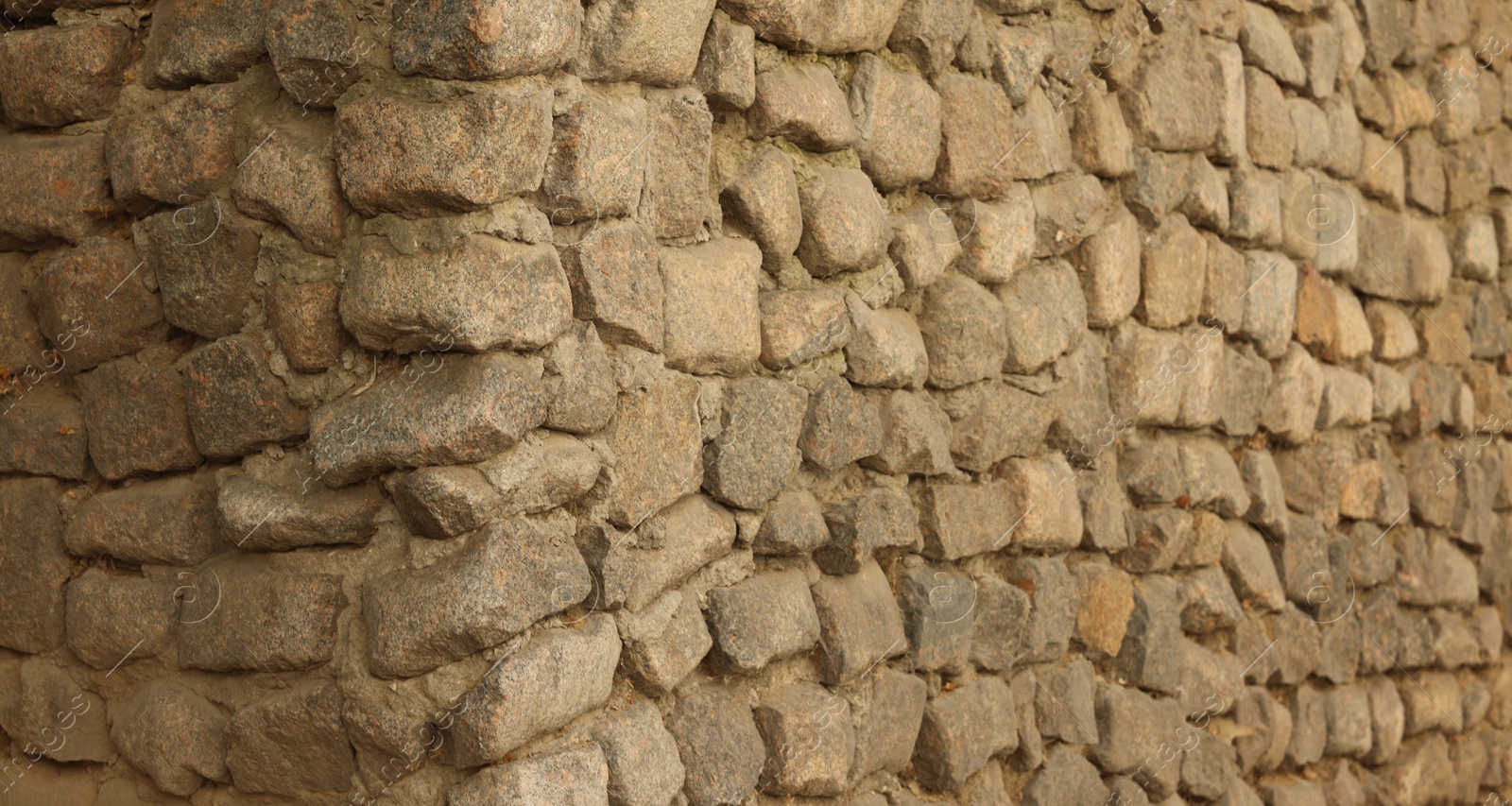 Photo of Texture of stone wall as background, closeup