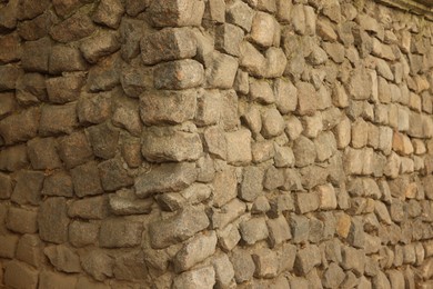 Photo of Texture of stone wall as background, closeup