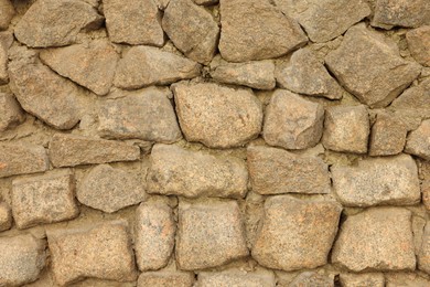 Photo of Texture of stone wall as background, closeup