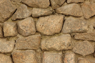 Photo of Texture of stone wall as background, closeup