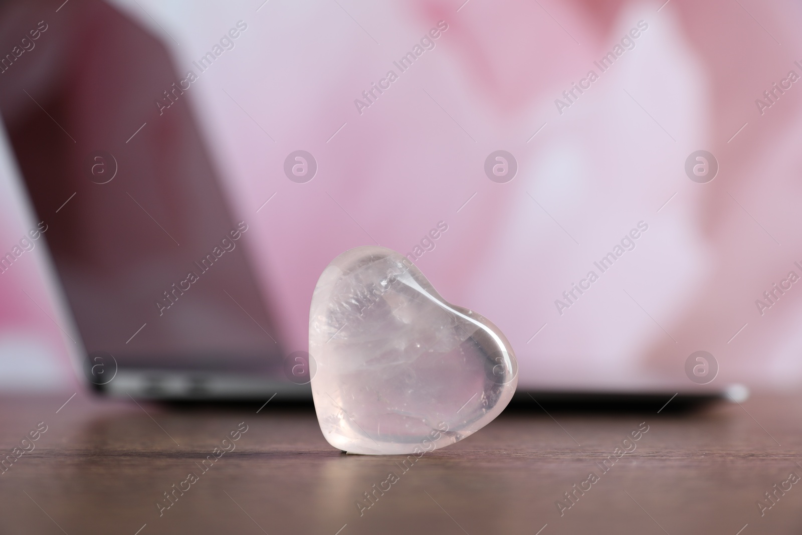 Decorative heart and laptop on wooden table, closeup. Online dating site Photo of Decorative heart and laptop on wooden table, closeup. Online dating site