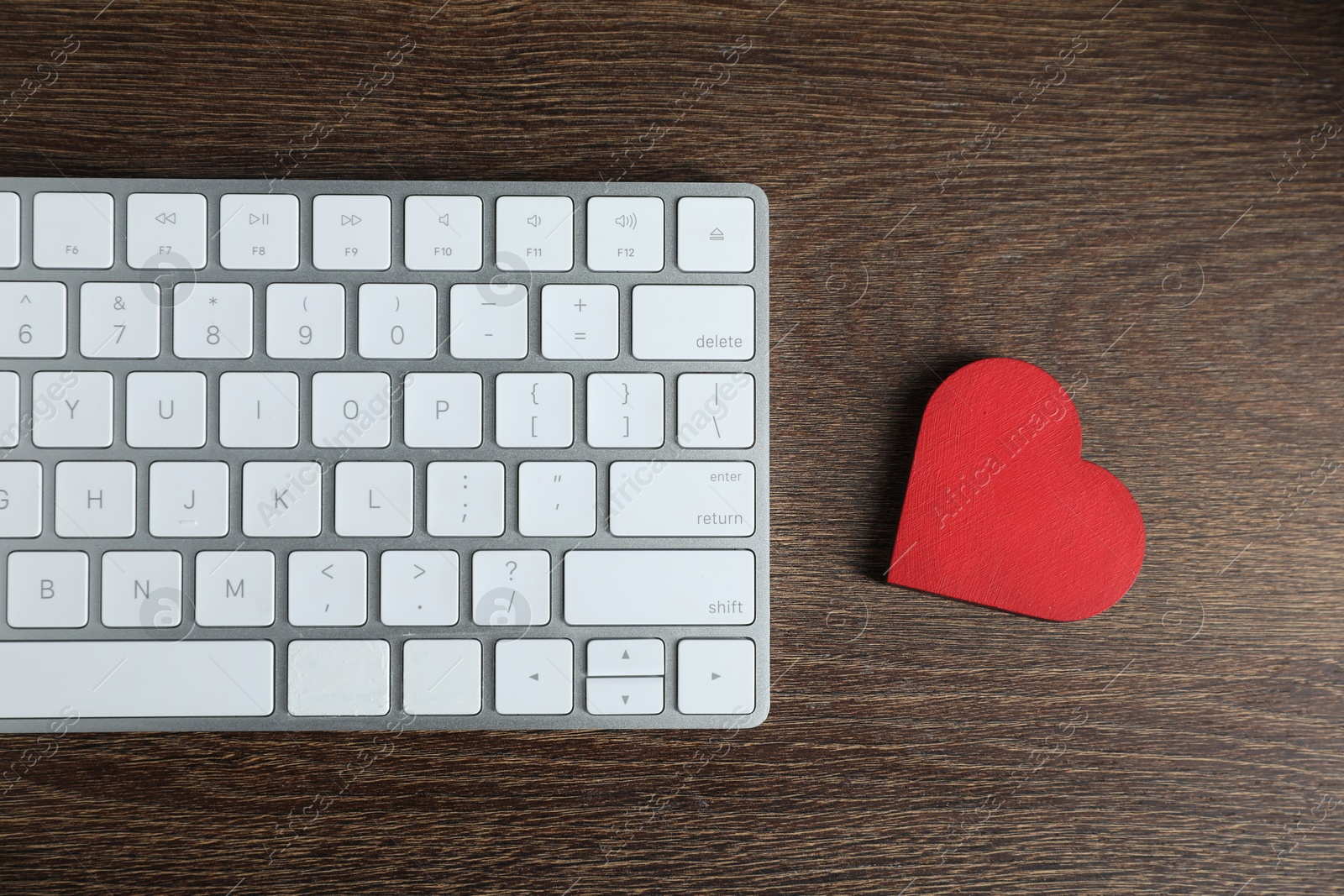 Decorative heart and computer keyboard on wooden table, flat lay. Online dating site Photo of Decorative heart and computer keyboard on wooden table, flat lay. Online dating site