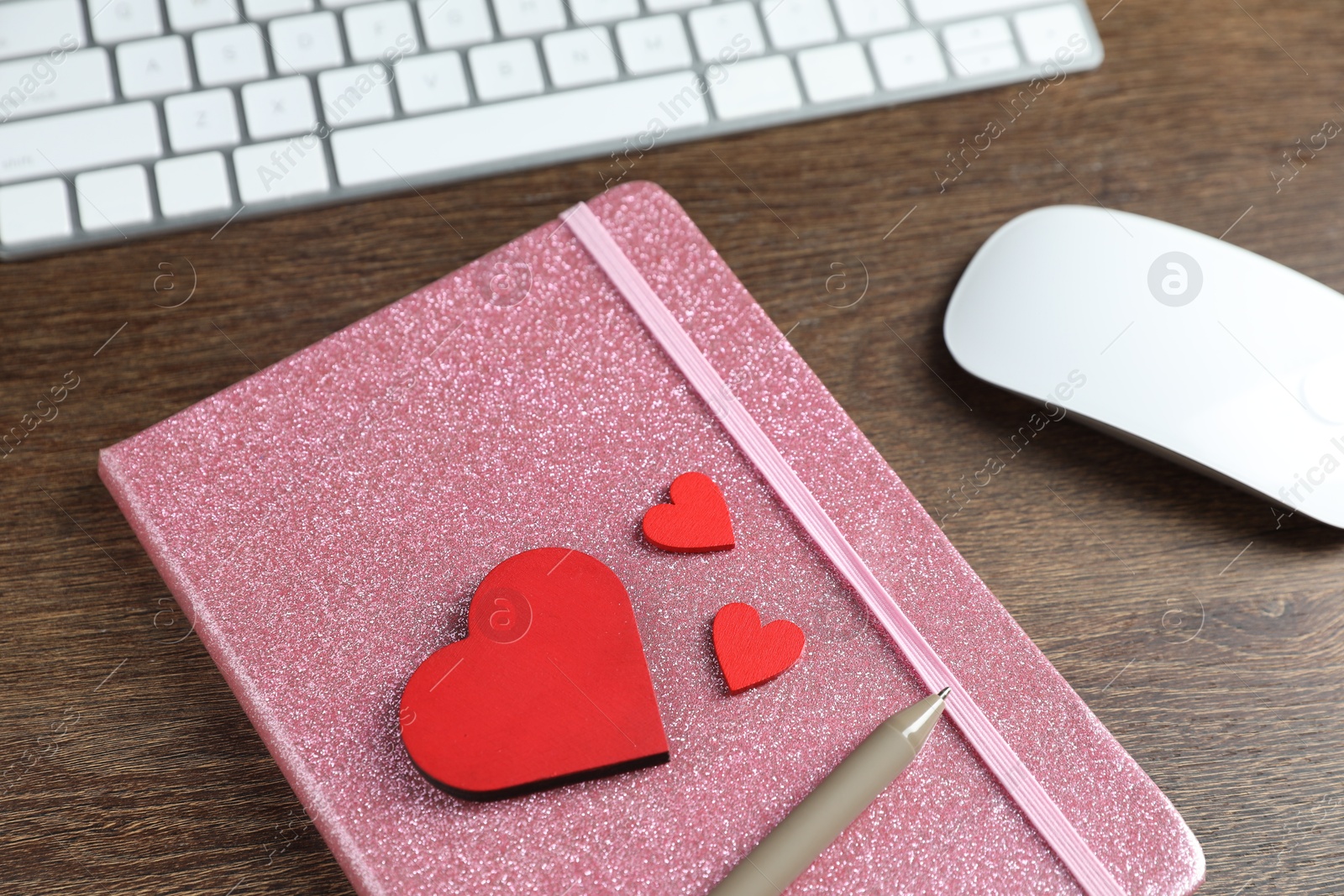 Decorative hearts, computer keyboard, mouse, notebook and pen on wooden table, above view. Online dating site Photo of Decorative hearts, computer keyboard, mouse, notebook and pen on wooden table, above view. Online dating site