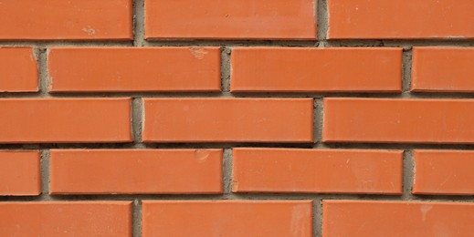 Photo of Texture of red brick wall as background, closeup