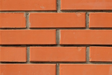 Photo of Texture of red brick wall as background, closeup