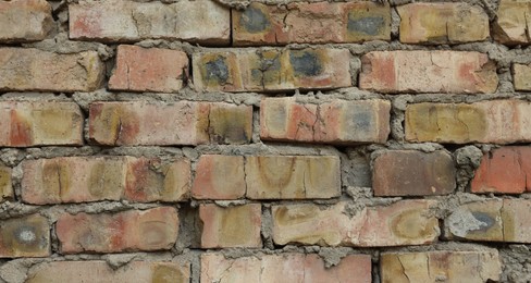 Photo of Texture of old brick wall as background, closeup