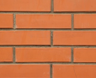 Photo of Texture of red brick wall as background, closeup