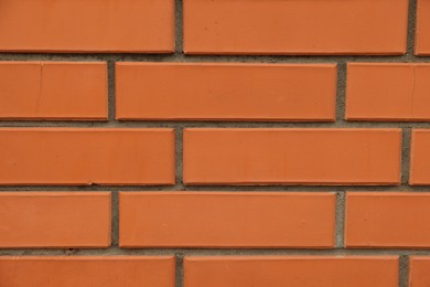 Photo of Texture of red brick wall as background, closeup