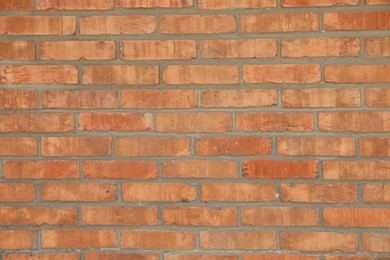 Photo of Texture of red brick wall as background, closeup