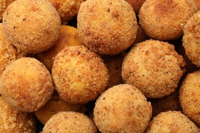 Photo of Delicious fried croquette balls as background, top view