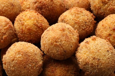 Photo of Delicious fried croquette balls as background, closeup