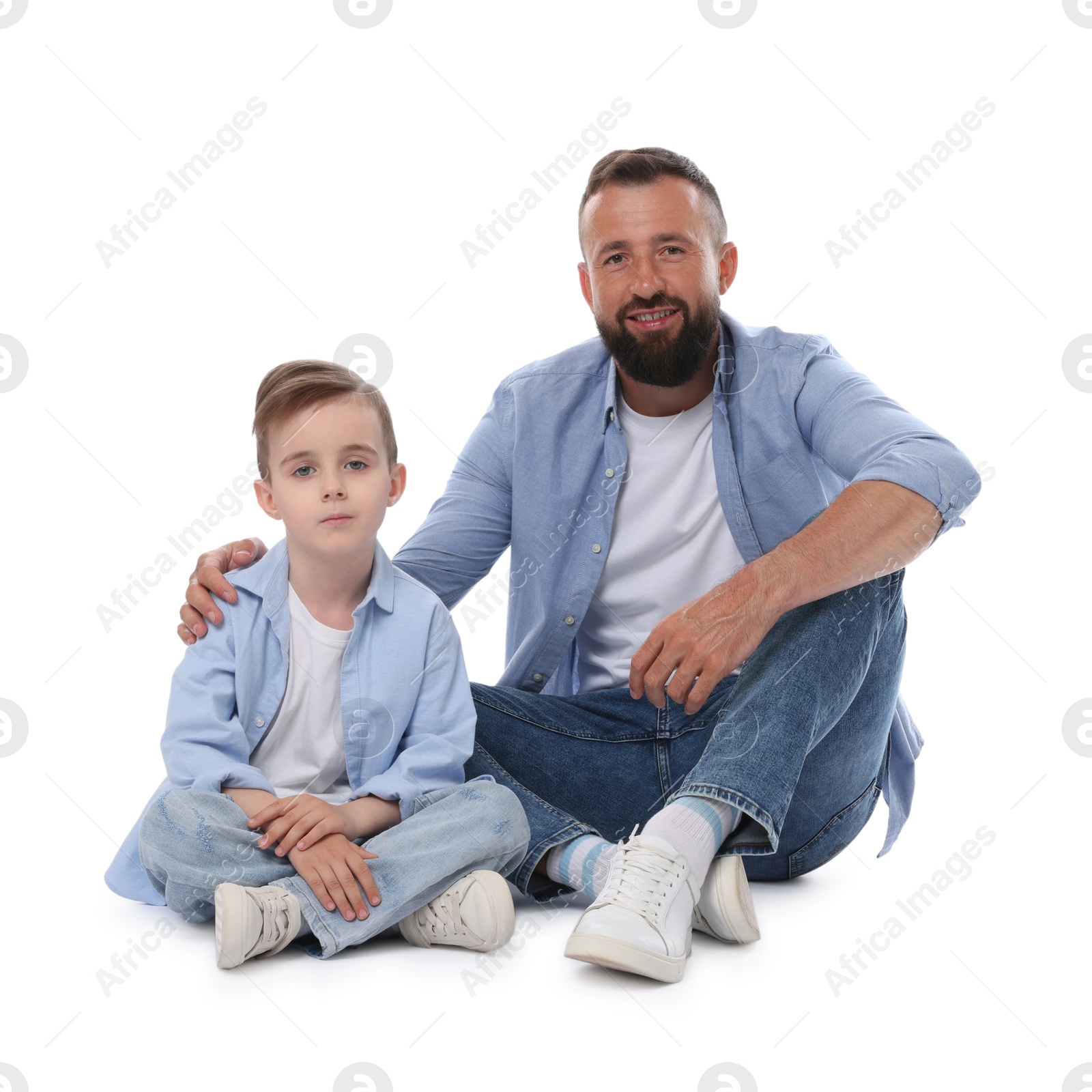 Family. Smiling dad and his son on white background Photo of Family. Smiling dad and his son on white background