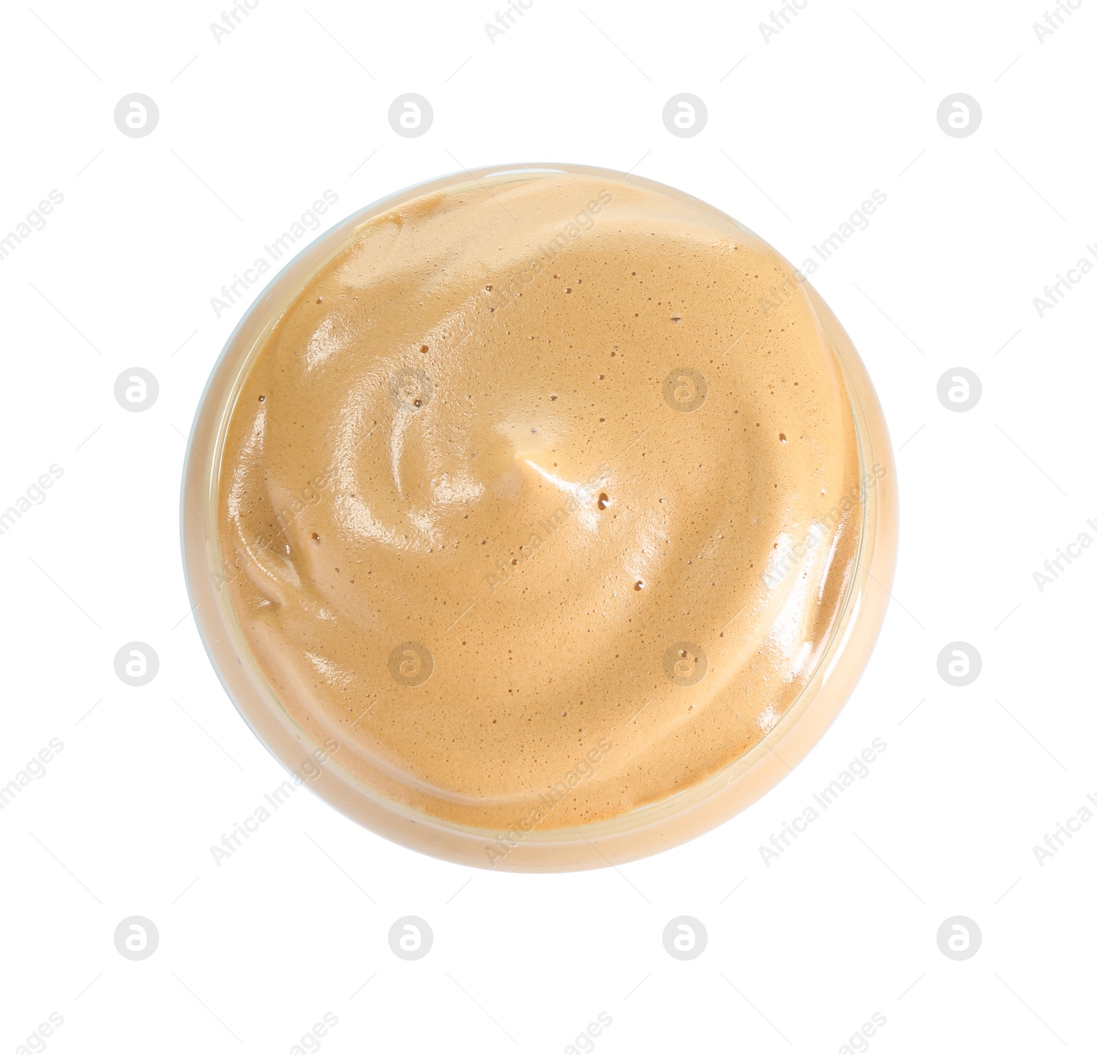 Photo of Delicious dalgona coffee in glass isolated on white, top view