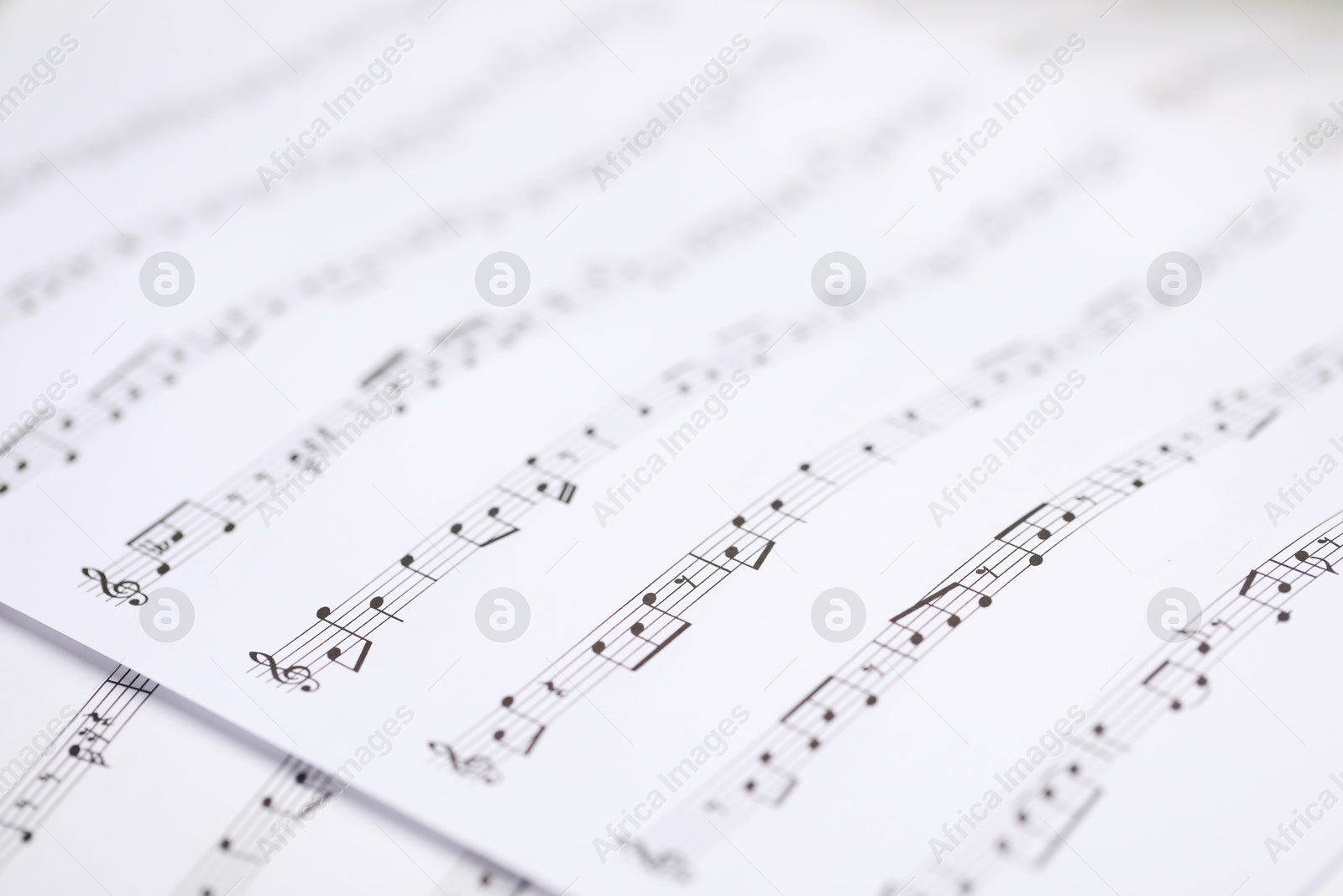 Sheets with musical notes as background, closeup Photo of Sheets with musical notes as background, closeup