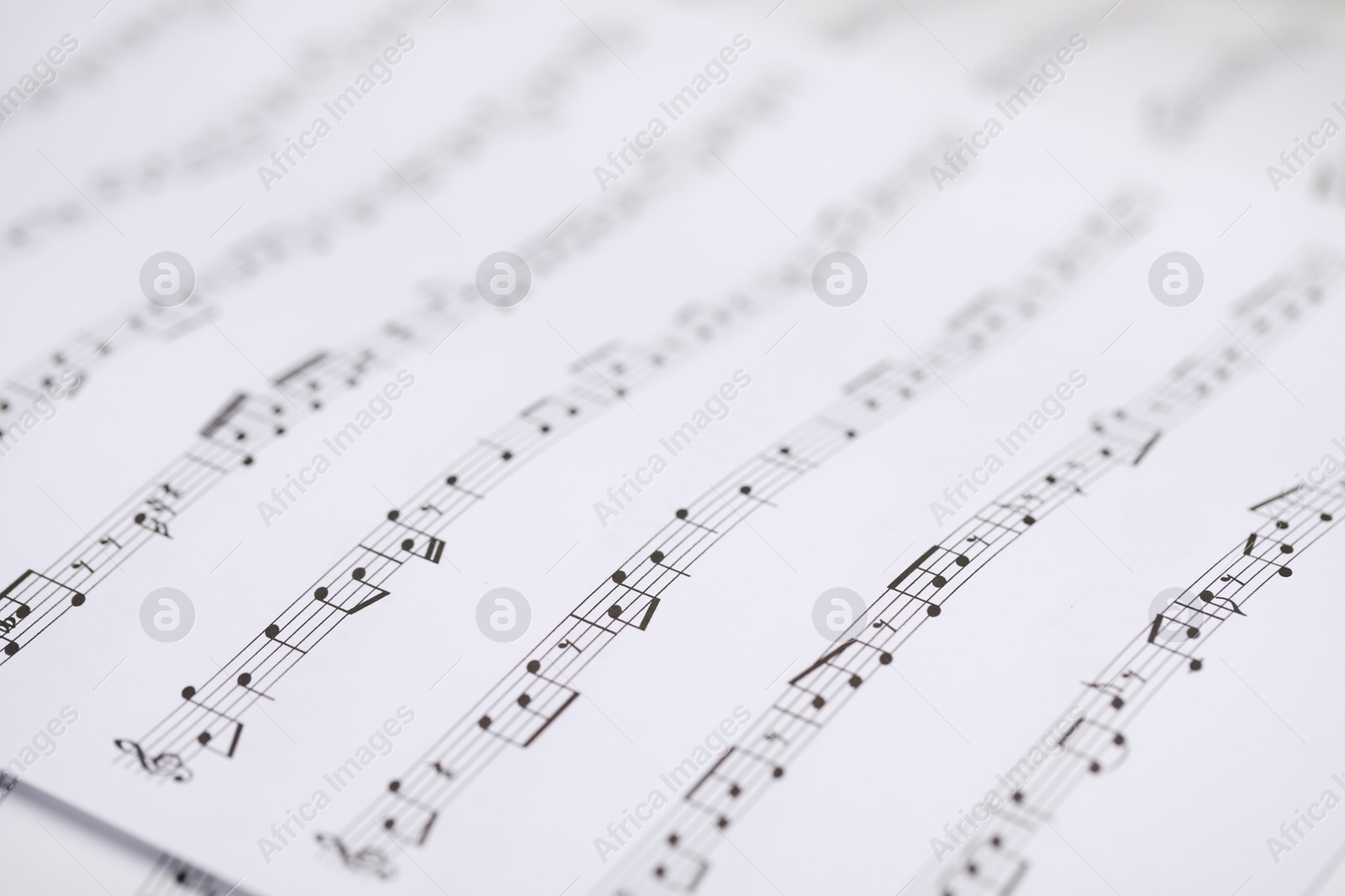 Sheets with musical notes as background, closeup Photo of Sheets with musical notes as background, closeup