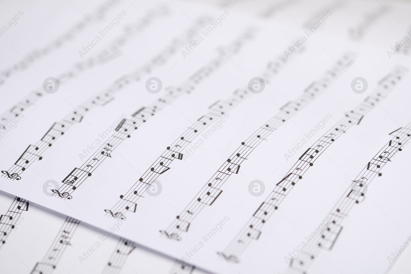 Sheets with musical notes as background, closeup Photo of Sheets with musical notes as background, closeup