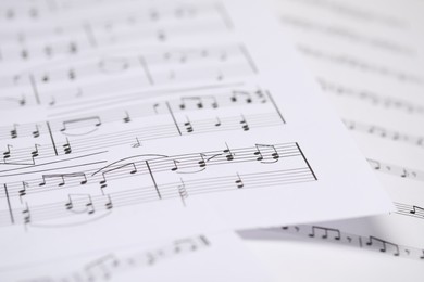 Photo of Sheets with musical notes as background, closeup