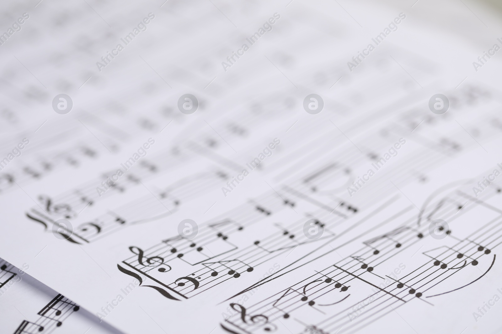Sheets with musical notes as background, closeup Photo of Sheets with musical notes as background, closeup