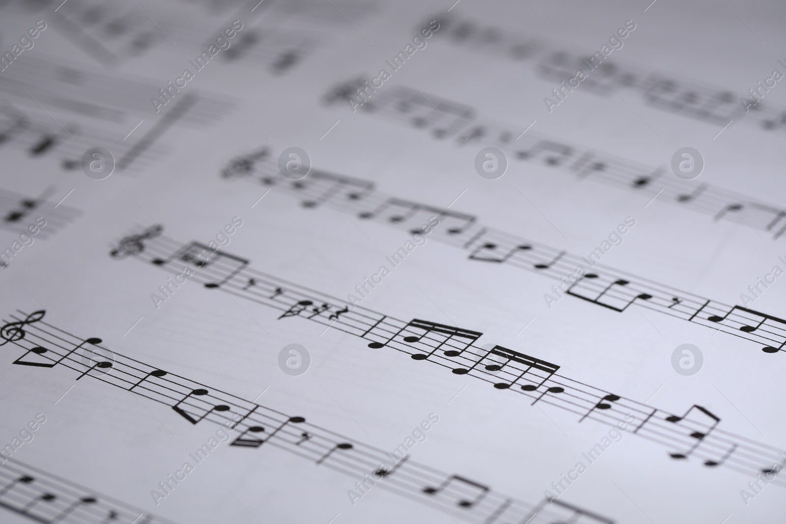 Sheet with musical notes as background, closeup Photo of Sheet with musical notes as background, closeup