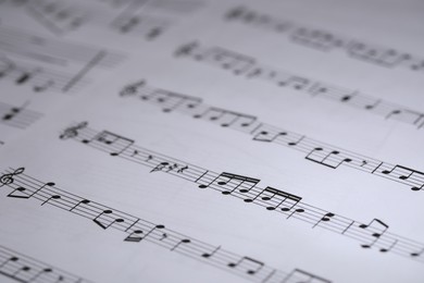 Photo of Sheet with musical notes as background, closeup