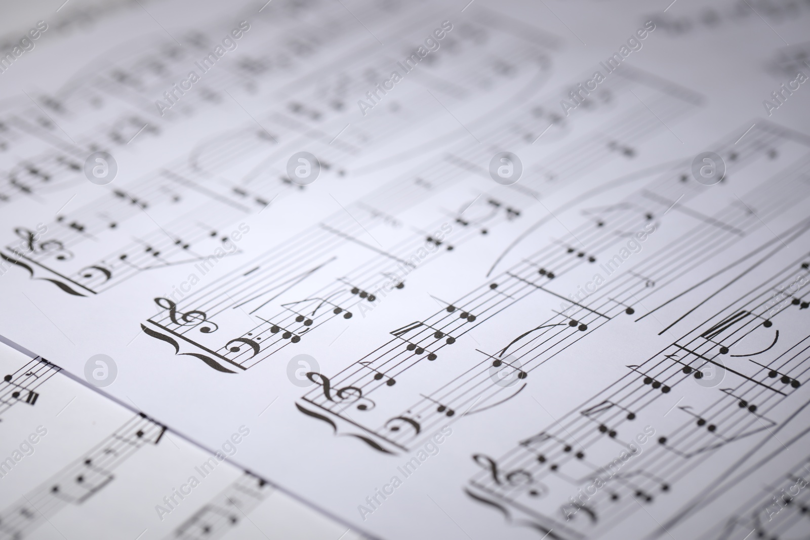 Sheet with musical notes as background, closeup Photo of Sheet with musical notes as background, closeup